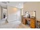 Upstairs hallway featuring a desk, and ample natural light at 6611 Dove Point Pl, Las Vegas, NV 89130