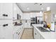 Bright kitchen with stainless steel appliances, large island, white cabinets, and easy access to dining area at 6611 Dove Point Pl, Las Vegas, NV 89130
