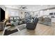 Spacious living room features modern furnishings, tile flooring, and an open concept design at 6611 Dove Point Pl, Las Vegas, NV 89130
