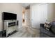 A relaxing sitting room featuring a comfortable sofa, and a mirrored cabinet at 6611 Dove Point Pl, Las Vegas, NV 89130