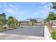 A view of the entrance to the community, featuring a decorative stone fence and gate at 6834 Fallen Rock St, North Las Vegas, NV 89084