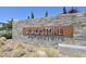 A sign for the Blackstone community set in a decorative stone wall at 6834 Fallen Rock St, North Las Vegas, NV 89084