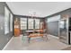 Modern dining area with stylish furniture, contemporary lighting, and a wine cooler for elegant entertaining at 6834 Fallen Rock St, North Las Vegas, NV 89084
