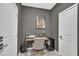 Cozy home office featuring a compact desk, comfortable chair, and modern appliances at 6834 Fallen Rock St, North Las Vegas, NV 89084