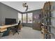 Stylish home office featuring a modern desk, ergonomic chair, and built in shelving at 6834 Fallen Rock St, North Las Vegas, NV 89084