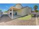 Backyard with covered patio and faux grass adding beauty and functionality at 6844 Tropicaire St, Las Vegas, NV 89149