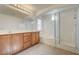 Bright bathroom featuring dual vanity, tub, and glass shower enclosure at 6844 Tropicaire St, Las Vegas, NV 89149
