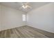 Bright bedroom featuring wood-look floors and neutral paint at 6844 Tropicaire St, Las Vegas, NV 89149