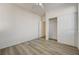 Comfortable bedroom featuring wood floors, closet, and neutral paint, ready to personalize with your own style at 6844 Tropicaire St, Las Vegas, NV 89149