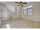 Living area with tile floors, a ceiling fan, and two bright windows overlooking the front yard and the entryway at 6844 Tropicaire St, Las Vegas, NV 89149