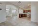 Open concept features living and kitchen areas with tile flooring for easy maintenance at 6844 Tropicaire St, Las Vegas, NV 89149