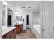 Well-lit bathroom featuring double sinks, a shower, and a bathtub for a spa-like experience at 7194 Clear Range Ave, Las Vegas, NV 89178