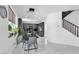 Open kitchen and dining area with ample natural light and staircase at 7194 Clear Range Ave, Las Vegas, NV 89178