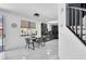 Bright kitchen featuring a dining table, sliding glass door and tile floors at 7194 Clear Range Ave, Las Vegas, NV 89178