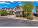 Inviting two-story stucco home with desert landscaping, tile roof and a two-car garage at 7194 Clear Range Ave, Las Vegas, NV 89178