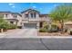 Charming two-story stucco home with desert landscaping and a two-car garage at 7194 Clear Range Ave, Las Vegas, NV 89178