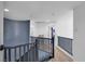 Upstairs hallway with wood floors and soft natural light creates a welcoming space at 7194 Clear Range Ave, Las Vegas, NV 89178