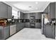 Modern kitchen with granite counters, stainless appliances, and dark cabinets at 7194 Clear Range Ave, Las Vegas, NV 89178