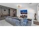 Modern living room features a sleek design, entertainment center and fireplace at 7194 Clear Range Ave, Las Vegas, NV 89178