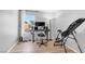 Functional home office with natural light, desk setup, and inversion table, perfect for productivity and wellness at 7194 Clear Range Ave, Las Vegas, NV 89178