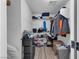 Spacious walk-in closet with shelving, storage, and laminate floors to organize clothes and accessories efficiently at 7194 Clear Range Ave, Las Vegas, NV 89178