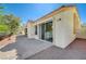 Backyard patio, perfect for outdoor relaxation and entertaining with smooth stucco wall and tile roof at 7460 Desert Flame Ct, Las Vegas, NV 89149