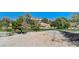 Scenic view of backyard and community greenery creating a serene outdoor atmosphere at 7460 Desert Flame Ct, Las Vegas, NV 89149