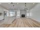 Bright dining area next to an open concept kitchen with a cozy fireplace at 7460 Desert Flame Ct, Las Vegas, NV 89149