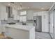 Spacious kitchen with a large center island, modern appliances, and white cabinets at 7460 Desert Flame Ct, Las Vegas, NV 89149
