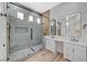 This primary bathroom showcases a luxurious walk-in shower and double vanity at 7460 Desert Flame Ct, Las Vegas, NV 89149