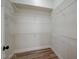 Walk-in closet featuring wire shelving and wood-style flooring at 7460 Desert Flame Ct, Las Vegas, NV 89149