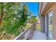 Enjoy views from this balcony overlooking mature trees and lush green space within the community at 76 Stock Option St # 2, Henderson, NV 89074