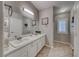 Spacious bathroom featuring double sinks, large mirror, and tile flooring at 76 Stock Option St # 2, Henderson, NV 89074
