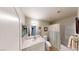 Clean bathroom features a vanity with a mirror, shower-tub combo, and tile flooring at 76 Stock Option St # 2, Henderson, NV 89074