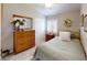 Cozy bedroom features a large dresser, mirror, and bed with shuttered window, and floral accents at 76 Stock Option St # 2, Henderson, NV 89074