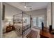 Relaxing bedroom with a four-poster bed, ceiling fan and french doors to the outside at 76 Stock Option St # 2, Henderson, NV 89074