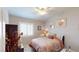 Cozy bedroom features a comfortable bed, a ceiling fan and a sunny window at 76 Stock Option St # 2, Henderson, NV 89074