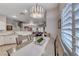 Charming dining area with a modern light fixture and shuttered windows provides great natural light at 76 Stock Option St # 2, Henderson, NV 89074