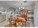 Inviting dining area with a round table, wooden chairs, and decorative china cabinet at 76 Stock Option St # 2, Henderson, NV 89074