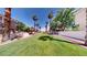 Lush greenbelt area with mature palm trees in a well-maintained community at 76 Stock Option St # 2, Henderson, NV 89074