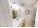 Stylish half bathroom features a decorative wreath and ample lighting at 76 Stock Option St # 2, Henderson, NV 89074