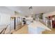Bright kitchen features white cabinets, stainless steel appliances, tile floors, and a breakfast bar at 76 Stock Option St # 2, Henderson, NV 89074