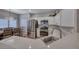 Modern kitchen with quartz countertops, stainless appliances, and an open floor plan at 76 Stock Option St # 2, Henderson, NV 89074