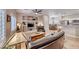 Open-concept living room with comfortable seating, built-ins, and a view of the dining area at 76 Stock Option St # 2, Henderson, NV 89074
