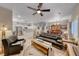 Spacious living room with open layout, modern furnishings, and adjacent kitchen and dining area at 76 Stock Option St # 2, Henderson, NV 89074