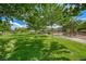 Serene park featuring mature trees, grassy areas, and a playground; perfect for outdoor recreation and relaxation at 76 Stock Option St # 2, Henderson, NV 89074