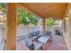 Inviting outdoor seating area on a brick patio with a covered space, perfect for relaxing outdoors at 76 Stock Option St # 2, Henderson, NV 89074