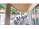 Covered patio with brick flooring and comfortable seating, perfect for outdoor relaxation and entertaining at 76 Stock Option St # 2, Henderson, NV 89074