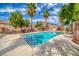 Community pool with sun loungers and a clear blue swimming area for relaxation and recreation at 76 Stock Option St # 2, Henderson, NV 89074