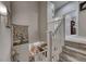 Carpeted staircase with white railing overlooking the lower level at 76 Stock Option St # 2, Henderson, NV 89074